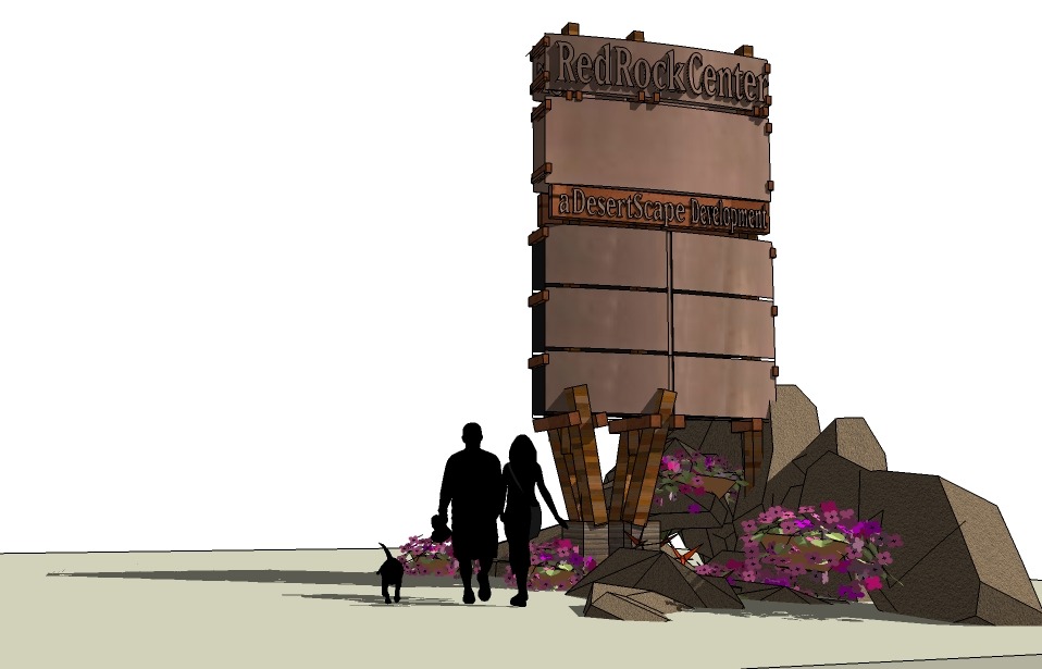 Sign for RedRock Center, featuring modern design and surrounded by flowers.