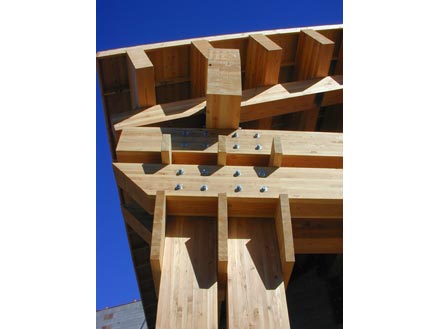 Detailed view of wooden structural joinery showcasing innovative fasteners and connections, emphasizing modern construction techniques in timber architecture.